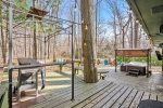 Wonderful outside space has a BBQ grill, many seating areas, fire pit, hot tub, and TV